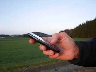 smartphone hand outside
