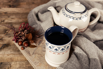 Cup of tea with book on table close-up
