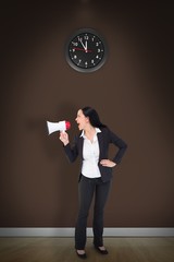 Composite image of pretty businesswoman shouting with megaphone