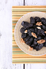 Plate of prunes and walnut