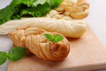 Smoked braided cheese close-up