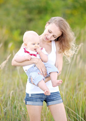 portrait of a happy family on summer nature