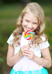 Portrait of a beautiful girl with candy