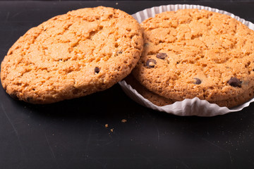 Oat cookies on the old shabby background. tinted