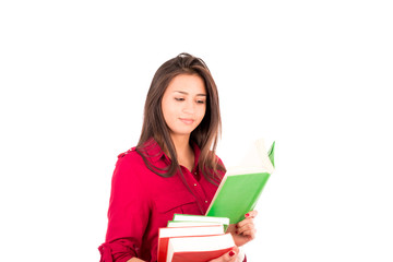 Young Latin Girl Holding stack of books and Reading