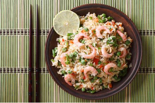 fried rice with seafood and egg close-up, horizontal top view