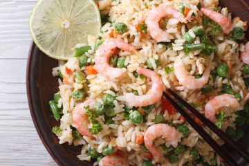 Asian fried rice with seafood macro, horizontal top view