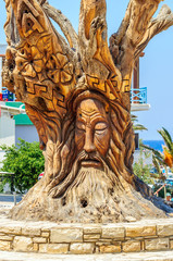Fototapeta na wymiar Famous tree with hippie face in Matala, Crete