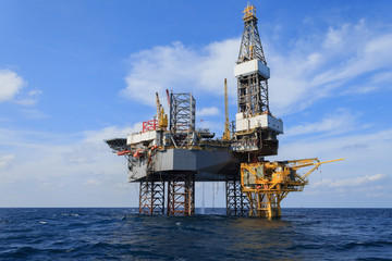 Offshore Jack Up Drilling Rig Over The Production Platform in Th