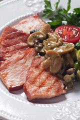 Grilled ham slices with mushroom sauce