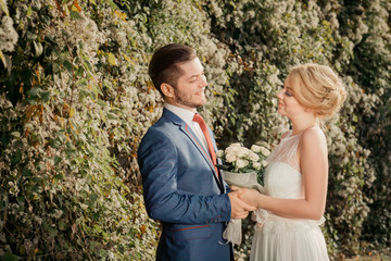 Romantic wedding couple looking at each other