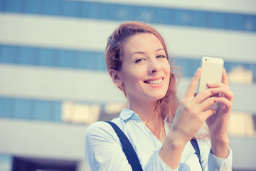 woman hands holding, using smart, mobile phone city background