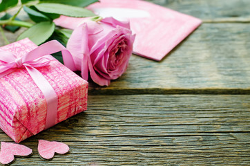 Valentine's background with a gift, flower and card