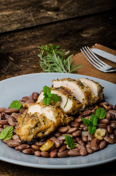 Roasted chicken breast with herbs and stewed beans