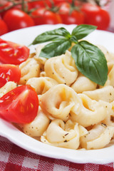 Tortellini pasta with tomato and basil