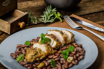Roasted chicken breast with herbs and stewed beans