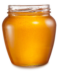 Glass can full of honey. File contains clipping paths.