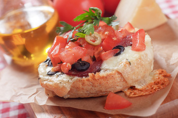 Cheese sandwich with tomato and olives