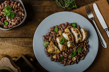 Roasted chicken breast with herbs and stewed beans
