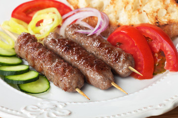 Kebab, meat skewer with fresh vegetable
