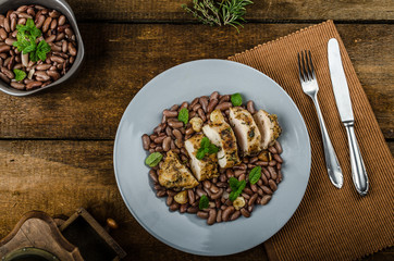 Roasted chicken breast with herbs and stewed beans