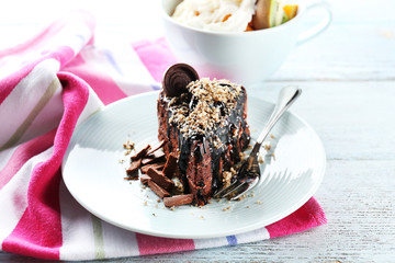 Yummy chocolate cake served on table