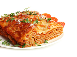 Portion of tasty lasagna, isolated on white