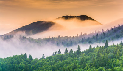 Fog over mountains at sunrise, seen from Devil's Courthouse, nea