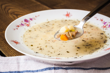 Fit creamy veal ragout soup on a spoon