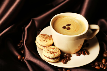Gentle colorful macaroons and black coffee in mug