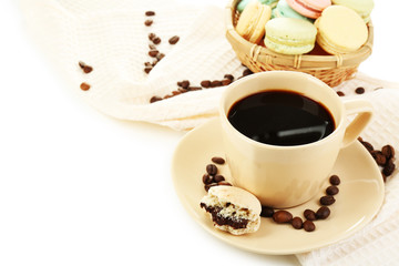Gentle colorful macaroons in  wicker basket and black coffee in