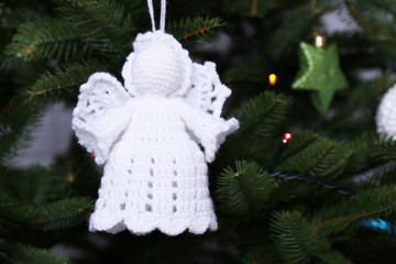 Obraz premium Knitted Christmas angels and other decorations
