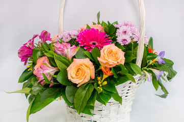White basket with roses
