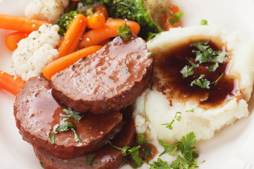 Meat loaf slices with mashed potato