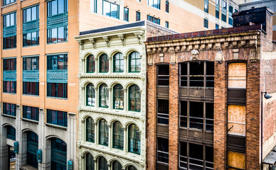 Fototapeta na wymiar Old buildings seen from a parking garage in Baltimore, Maryland.