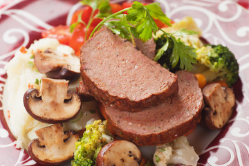 Classic meatloaf with mushrooms and vegetables