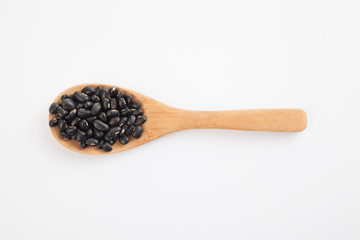 Black beans with wooden spoon
