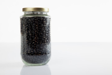 Black beans in a jar with close lid