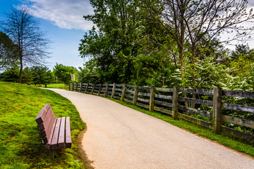 Bench and fence along a path in Centennial Park in Columbia, Mar