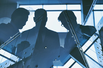 Reflection of three men