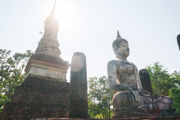 Buddha sculpture and temple ruins in Sukhothai historical park,