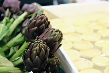 artichokes for sale in stand of greengrocers to local market