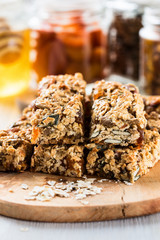 Healthy homemade granola bars and   ingredients  on  background