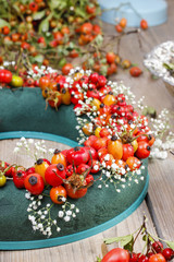 Steps of making door wreath with rose hip, hawthorn and rowan be