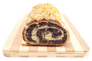 Poppy seed cake on wooden cutting board