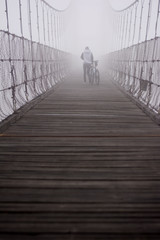 girl walking in to the mist ,Thailand