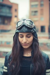 aviator young beautiful brunette woman with cap and glasses