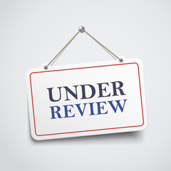 under review hanging sign