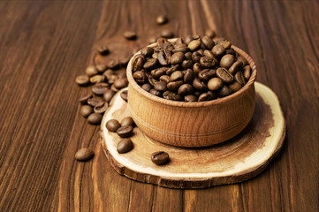 Roasted coffee beans in a wooden bowl
