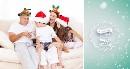 Obraz premium Family on christmas day looking at their presents at home